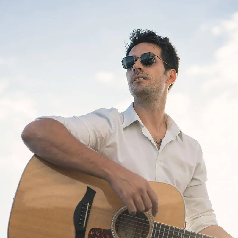 Stelios Antoniou Taylor guitar sunglasses outdoor Cyprus